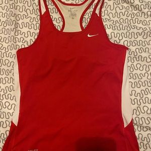 Nike sports shirt with built in bra. Used but has life left in it